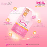 The label reads "Tinted Sunscreen, Facial Primer, Broad Spectrum Protection, Brilliant Skin Essentials" with a picture of a sun on it.