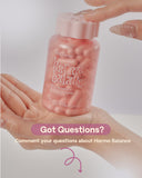 Hand holding a pink bottle labeled 'Hormo Balance' with text prompting questions about the product.